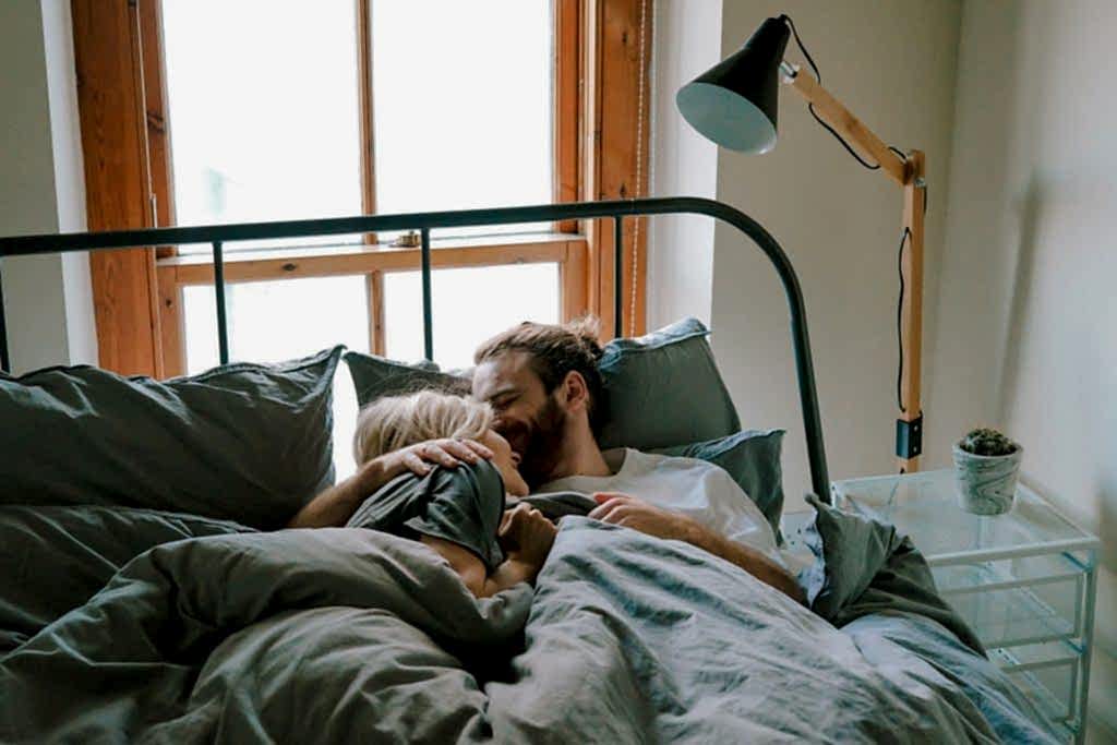 cute couple lying in bed