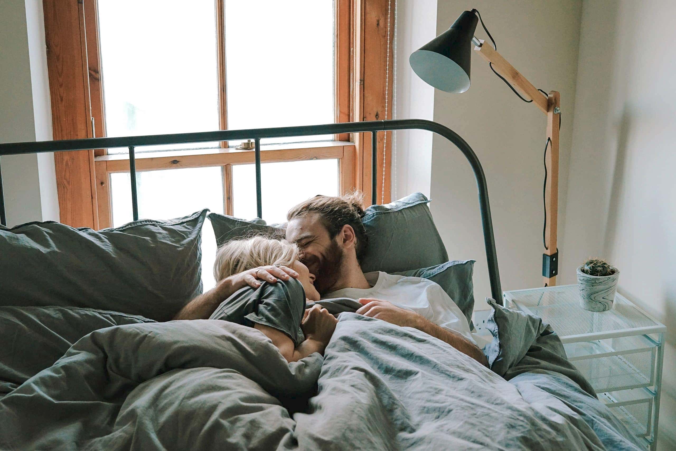 cute couple lying in bed