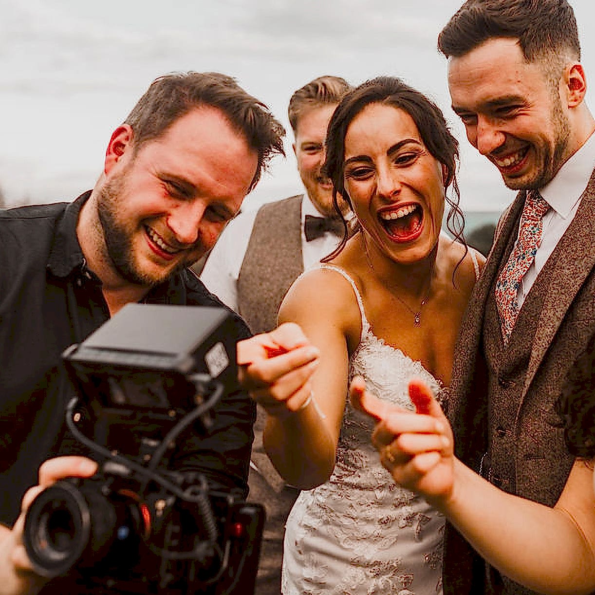 Couple laughing happy at photos shown by Declan West